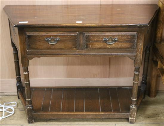 A 17th century style oak side table W.108cm